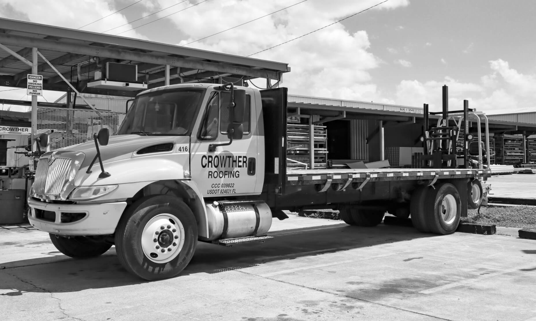 Crowther Roofing and Cooling flatbed equipment for roof replacement and roof repairs in Lee County, FL.