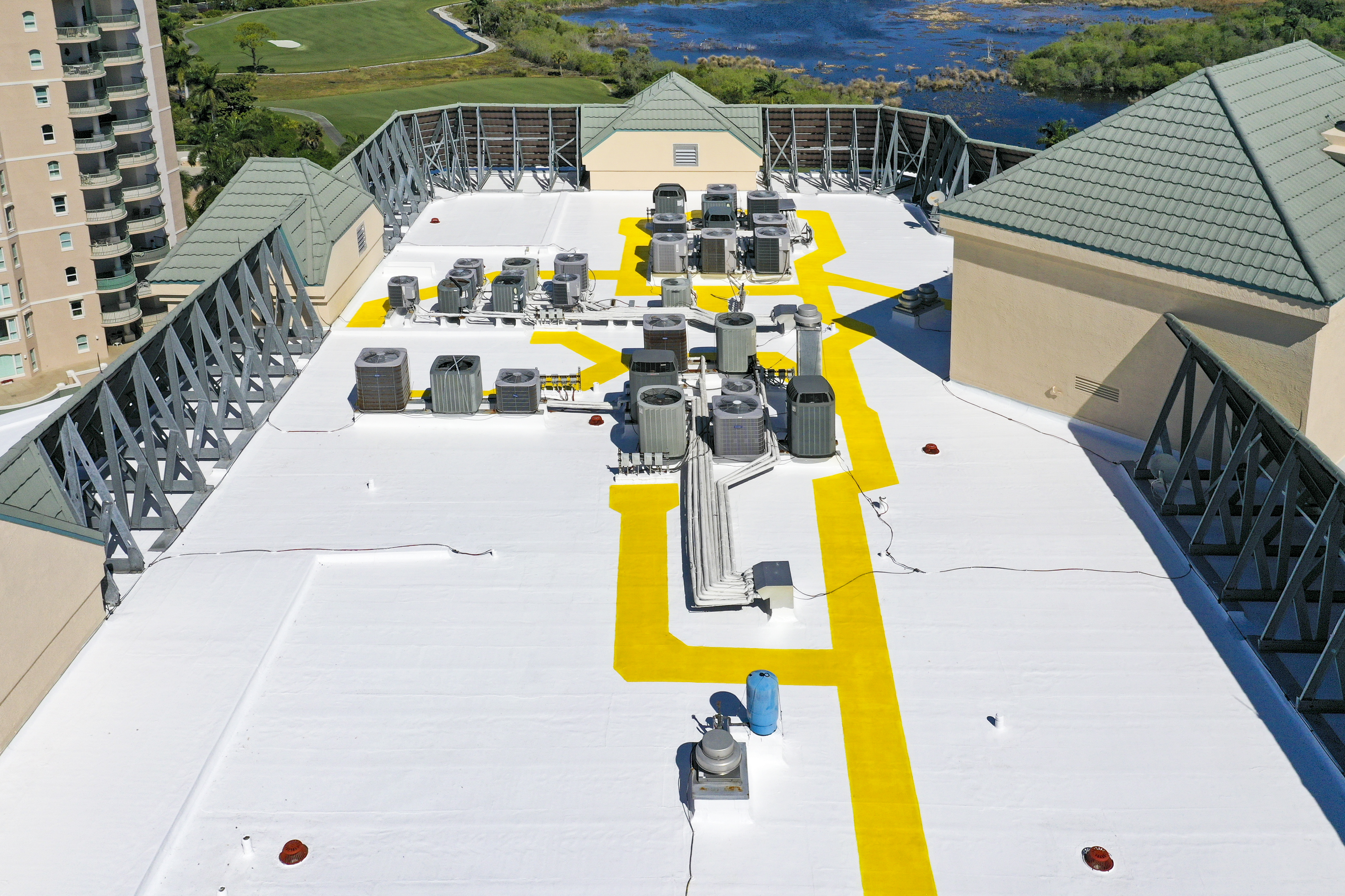 Roof coatings at Bay View condos in Naples by Crowther Roofing and Cooling