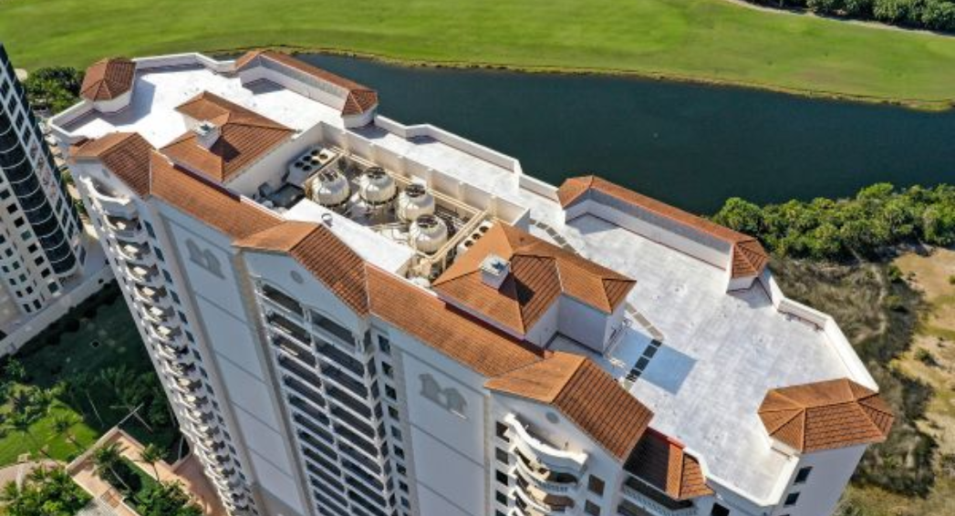 Karnak roof coating by Crowther Roofing and Cooling on Florencia Condo in Bonita Springs