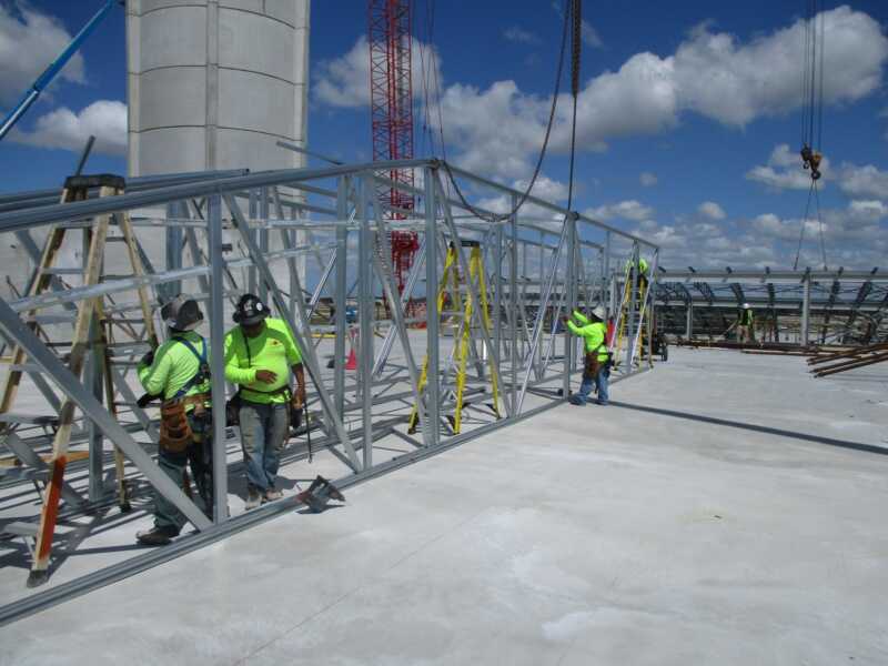 Light Gauge Metal Trusses being installed at RSW in Fort Myers by Crowther Roofing and Cooling